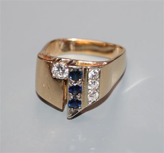 A modern 14k yellow metal, sapphire and diamond set dress ring, with square shaped shank, size P